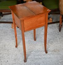 An Edwardian satinwood work table with butterfly-opening top, enclosing a silk lined interior with