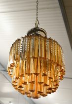 A vintage Murano style three-tier 'Waterfall' chandelier with amber glass drops