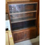 Two similar Minty bookcases, with sliding glass doors over a pair of cupboards, 90 cm x 23 cm x