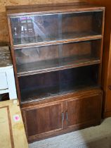 Two similar Minty bookcases, with sliding glass doors over a pair of cupboards, 90 cm x 23 cm x