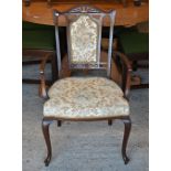 An Art Nouveau walnut Edwardian elbow chair