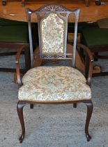 An Art Nouveau walnut Edwardian elbow chair