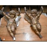 A pair of old gilt plaster cherubs