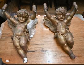 A pair of old gilt plaster cherubs