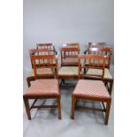 A set of eight mahogany bar and part spindle-back dining chairs, with drop-in fabric seats and