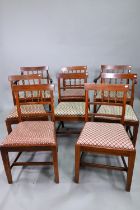 A set of eight mahogany bar and part spindle-back dining chairs, with drop-in fabric seats and