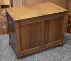 A small light oak coffer with double hinged top, cedar line, raised on bun feet, 75 cm w x 46 cm x