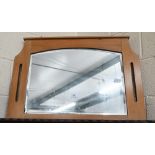 An Arts & Crafts style mirror with bevelled plate