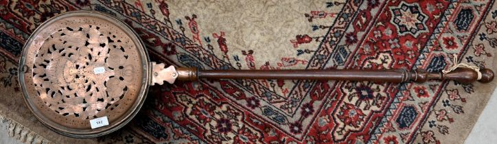 Antique pierced and engraved copper warming pan with turned wooden handle