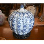A Chinese blue and white porcelain melon-shaped jar and cover, on carved wood stand, 24 cm diam