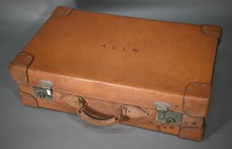 A vintage pigskin suitcase with fitted interior