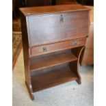 An Arts & Crafts period slope front bureau, over a drawer and two open shelves, 75 cm w x 31 cm x