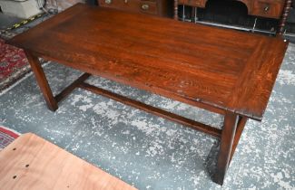 Brights of Nettlebed, an oak refectory dining table, the wide cleated top raised on chamfered square