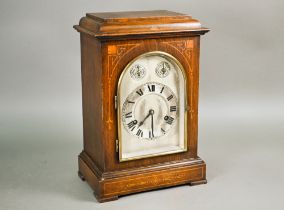 A German oak inlaid mantel clock with twin-train eight day movement striking on gongs c/w pendulum