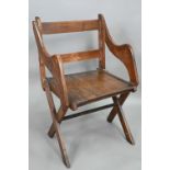 An antique Glastonbury style oak chair