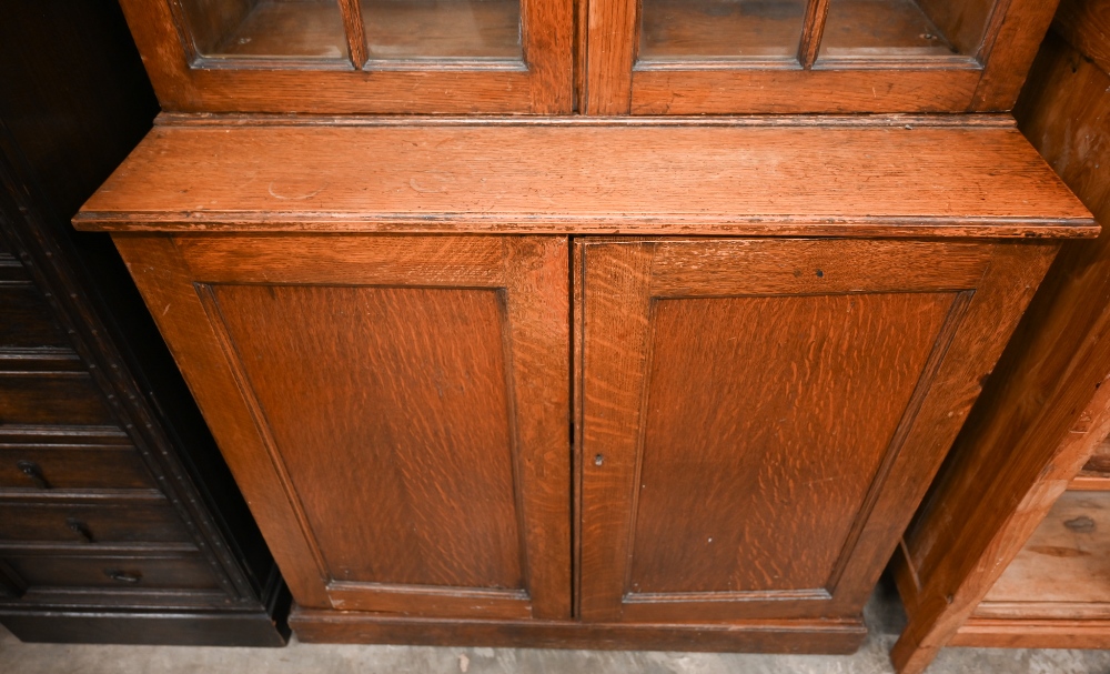 An early 20th century oak cabinet bookcase, the top section with glazed doors enclosing adjustable - Image 4 of 5