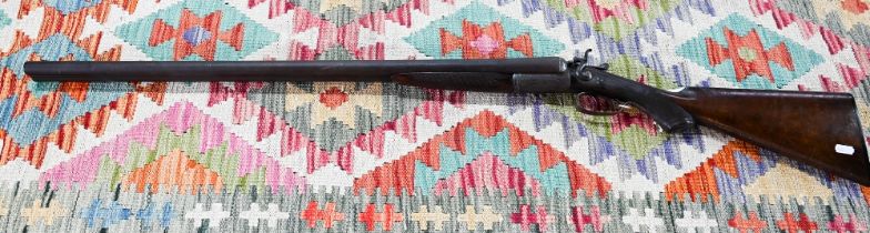 An antique 12 bore double-barrelled shotgun with hammer action by George Graham & Sons, Oxford