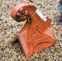 A weathered terracotta roof ridge end finial, 37 x 33 cm