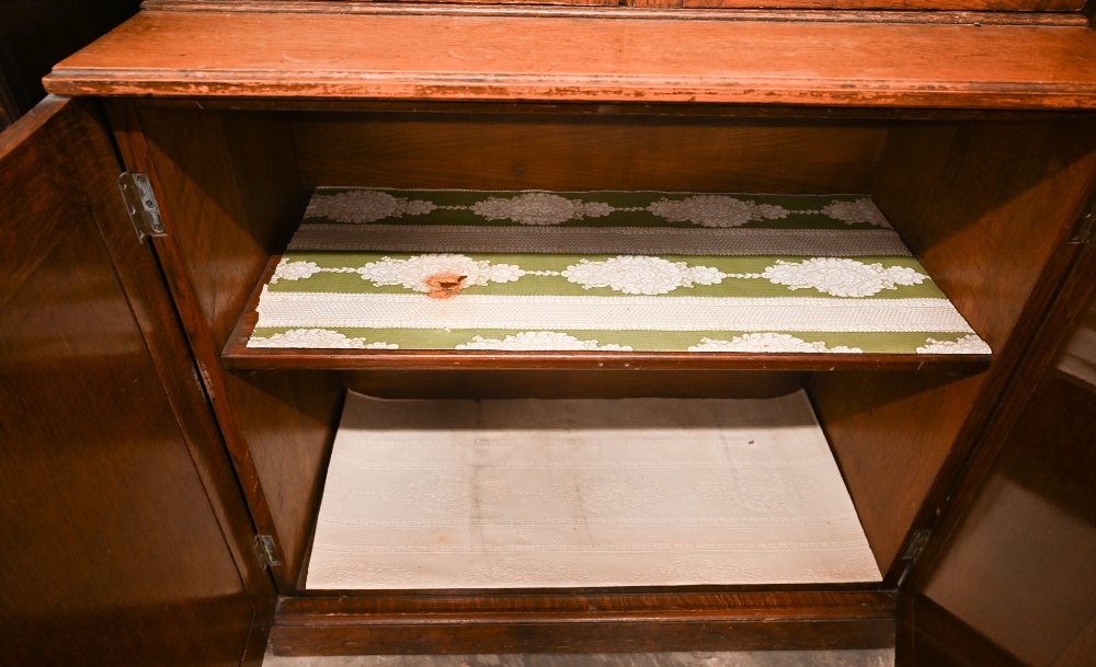 An early 20th century oak cabinet bookcase, the top section with glazed doors enclosing adjustable - Image 5 of 5