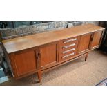Victor Williams for G-Plan, a mid-century teak 'Fresco' sideboard, centred by four drawers flanked