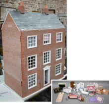 A kit built three storey doll's house, brick faced with hinged split front to/w a quantity of