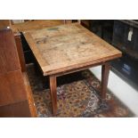 An old oak draw leaf dining table, raised on square legs