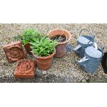 A pair of cast terracotta floral tiles to/w three terracotta pots and two galvanised watering