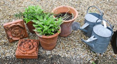 A pair of cast terracotta floral tiles to/w three terracotta pots and two galvanised watering