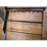 A companion pair of 18th century style oak Delft racks, with wavy canopy tops over two shelves,