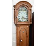 A 19th century provincial pine longcase clock with thirty hour movement, the dial painted with