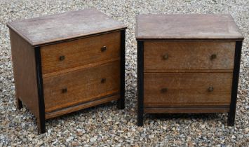 A pair of mid century small oak and ebonised two drawer chests, 62 cm wide x 44 cm deep x 60 cm high