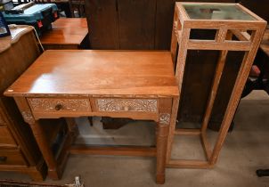 A limed and carved oak two drawer hall table, 82 cm wide x 50 cm deep x 75 cm high to/w limed oak