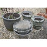 A trio of weathered cast stone planters to/with another pair and a large single planter (6)