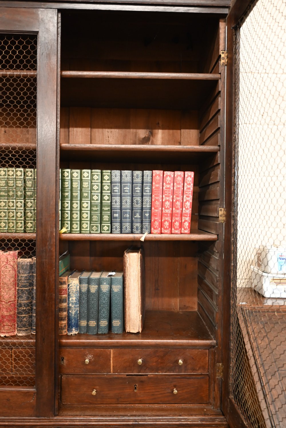 An antique oak cabinet bookcase, the lattice wire panelled doors enclosing shelves and small drawers - Image 2 of 8