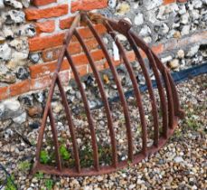 An old cast iron corner hay feeder