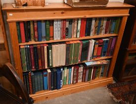 A stained pine open bookcase with two shelves, 126 cm wide x 24 cm z 106 cm high