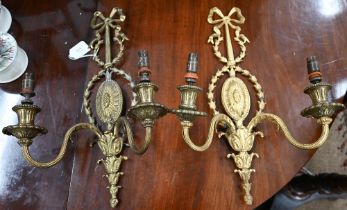 A pair of Adam-style gilt metal twin-branch wall-lights, 45 cm high