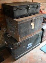 Two vintage black tin trunks to/with a steel bound trunk and a black tin box (4)