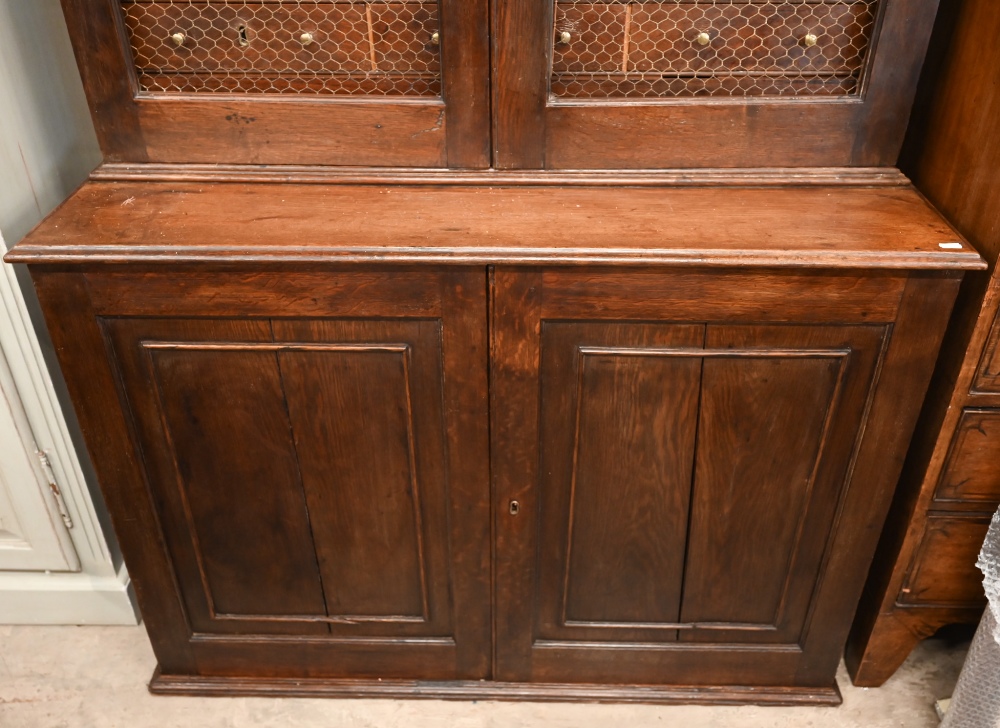 An antique oak cabinet bookcase, the lattice wire panelled doors enclosing shelves and small drawers - Image 8 of 8