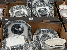 A Spanish monochrome-printed pottery dinner service (2 boxes)