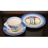 A Wedgwood Clarice Cliff Centenary Bizarre tea cup, saucer and plate decorated with 'Blue Firs'