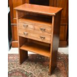 An Edwardian open bookcase with three drawers (the back cut-out for skirting), 62 cm x 30 cm x 97 cm