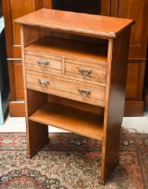 An Edwardian open bookcase with three drawers (the back cut-out for skirting), 62 cm x 30 cm x 97 cm