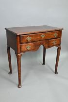 An 18th century fruitwood three drawer side table with arched apron on turned legs and pad feet,
