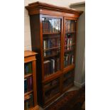 A 19th century mahogany bookcase with adjustable shelving and glazed doors, 116 cm x 34 cm x 174