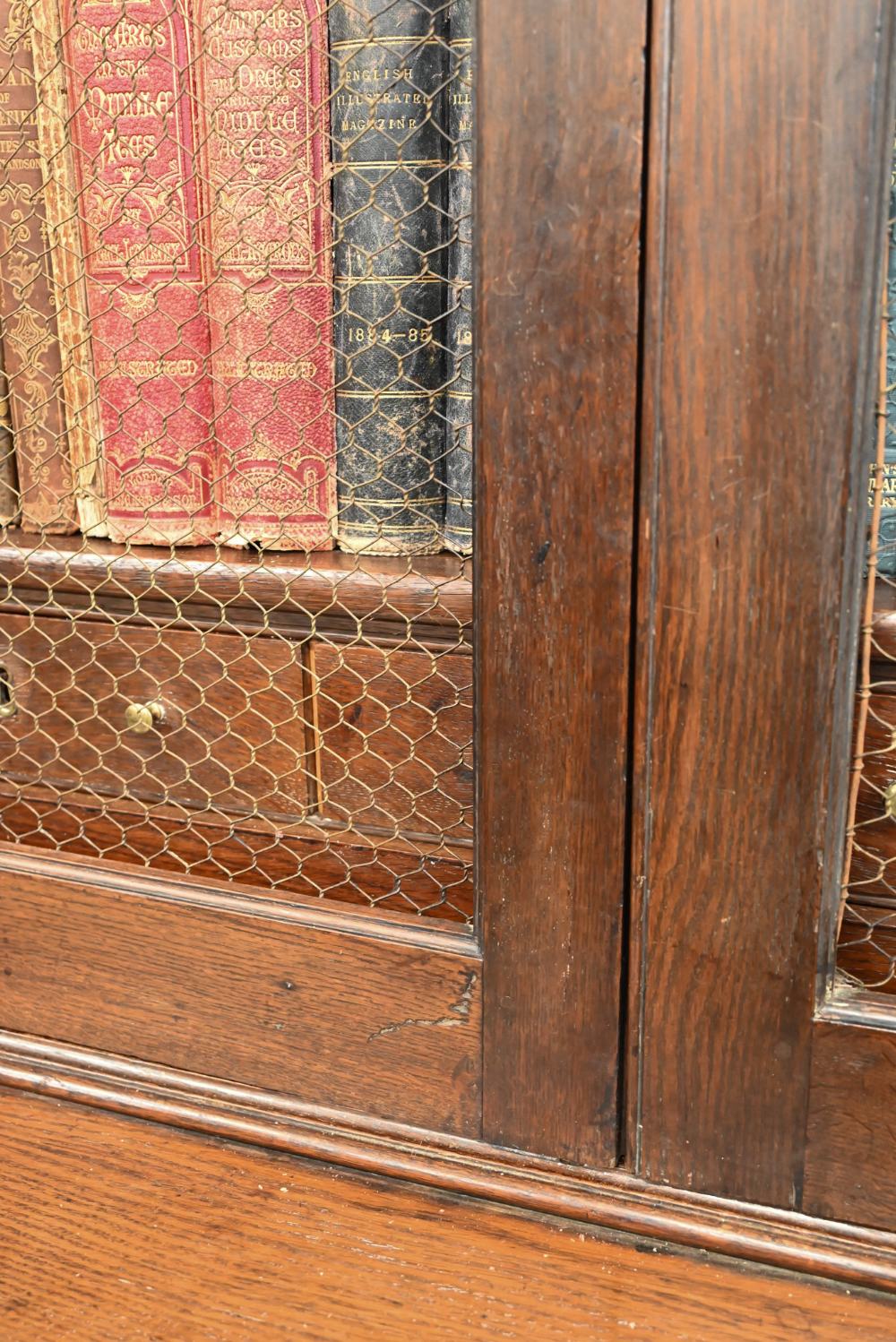 An antique oak cabinet bookcase, the lattice wire panelled doors enclosing shelves and small drawers - Image 4 of 8