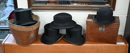 Two antique leather gentleman's hat-boxes to/w three top hats, two by Whites of Jermyn St and one by