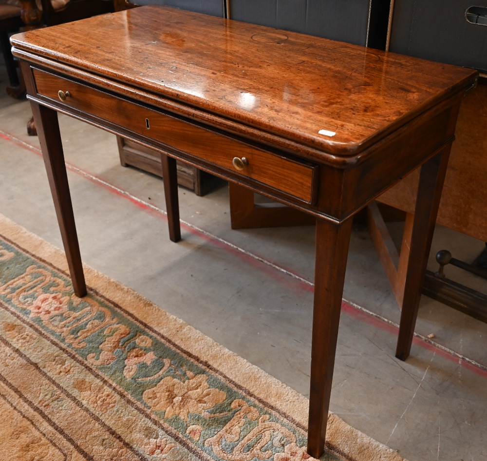 A 19th century mahogany folding tea table with single frieze drawer, tapering square supports, 92 cm