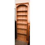 A shallow pine open bookcase, 66 x 18 x 200 cm high