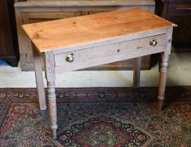 A pine single drawer side table raised on turned legs, 98 cm x 48 cm x 72 cm h